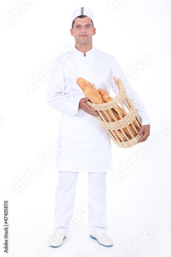 Photo: Baker with bread basket Baker with bread basket
