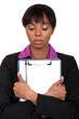 Sad woman holding a clipboard