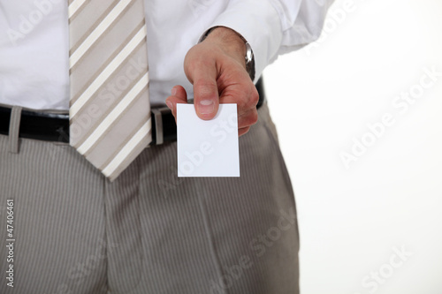 Photo: Businessman offering his card Businessman offering his card