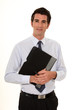 Confident businessman holding folder