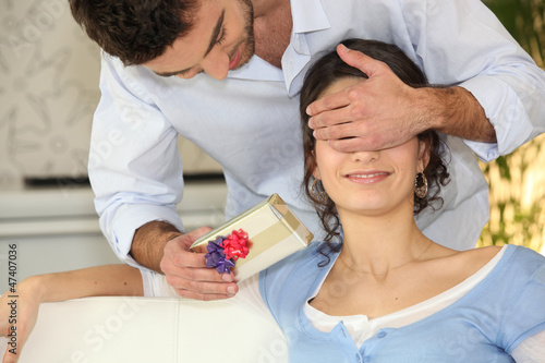 Photo: Man offering surprise gift Man offering surprise gift