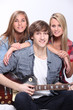 Teenagers playing the guitar