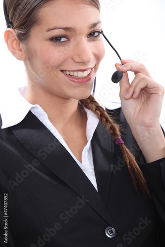 Photo: Smiling female telemarketer Smiling female telemarketer
