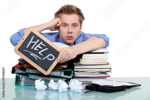 Photo: An overworked office worker An overworked office worker
