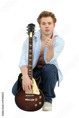 Photo: Man posing with his guitar Man posing with his guitar