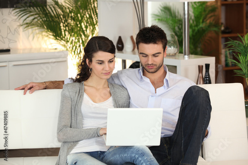Photo: happy young couple at home happy young couple at home