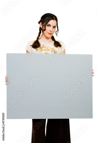 Photo: Young woman holding placard Young woman holding placard