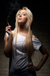 Photo: Portrait of young blonde woman with a cigarette Portrait of young blonde woman with a cigarette