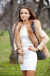 Portrait of beautiful young woman in fur