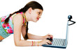 Foto: Cute girl using a laptop Cute girl using a laptop