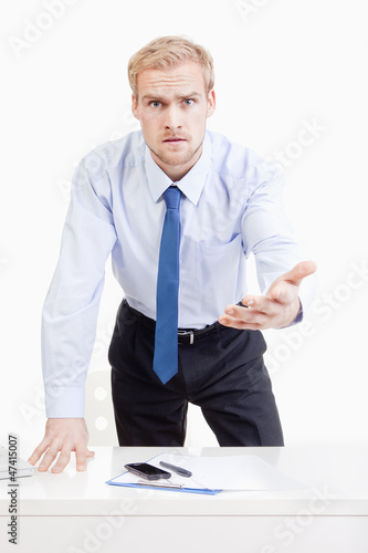 Photo: angry boss behind desk angry boss behind desk