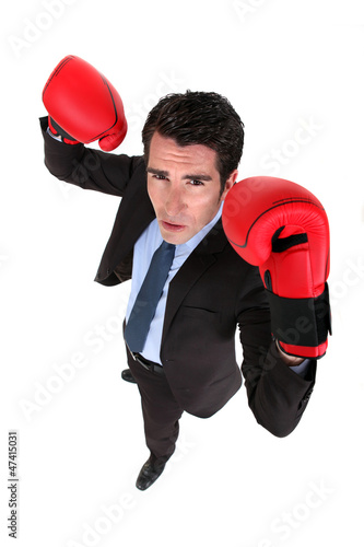 Photo: Successful businessman with boxing gloves Successful businessman with boxing gloves