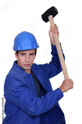 Photo: Man wielding sledge-hammer Man wielding sledge-hammer