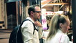 Couple of tourist buying something in the street market, evening