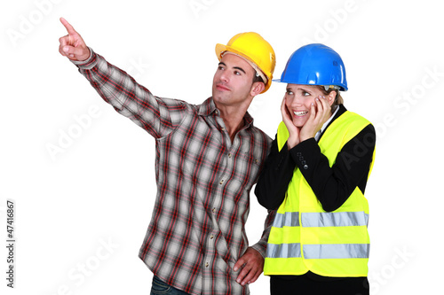 Photo: Scared architect stood with builder Scared architect stood with builder