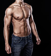 Portrait of handsome man posing on black background