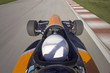 bolide driving at high speed in circuit.Camera on board