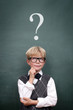 Schoolboy at the Blackboard with Questionmark