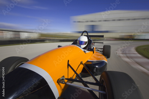 Photo: bolide driving at high speed in circuit.Camera on board view bac bolide driving at high speed in circuit.Camera on board view bac