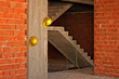 Construction workers yellow hard hats hanging on concrete wall