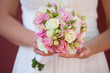 Photo: wedding bouquet of roses in the hands of the bride wedding bouquet of roses in the hands of the bride