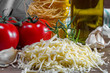 Grated cheese and tomatoes on a board