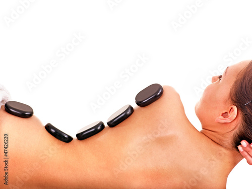 Photo: Woman getting spa lastone therapy . Woman getting spa lastone therapy .