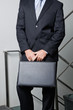 Midsection Of Young Businessman Carrying Briefcase