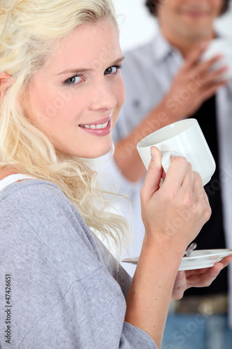 Photo: Young woman with a hot drink Young woman with a hot drink