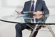 Businessman Using Digital Tablet In Office