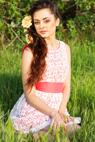 Photo: Beautiful woman with flowers in her hair Beautiful woman with flowers in her hair