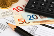 COMPOSITION OF PAPERS, MONEY, CALCULATOR AND PENCIL