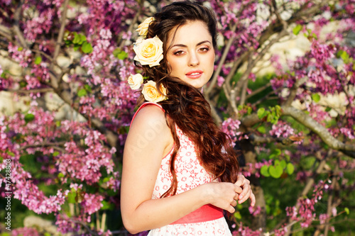 Photo: Beautiful woman with flowers in her hair Beautiful woman with flowers in her hair