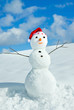 Snow man in santa cap on nature