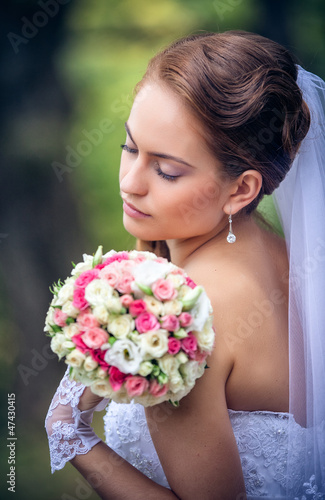 Photo: shot of a beautiful caucasian bride outdoor shot of a beautiful caucasian bride outdoor
