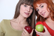 Girls holding apples