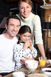 Family enjoying breakfast together