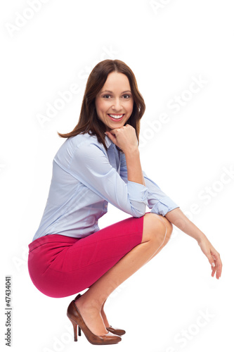 Photo: Businesswoman crouching Businesswoman crouching