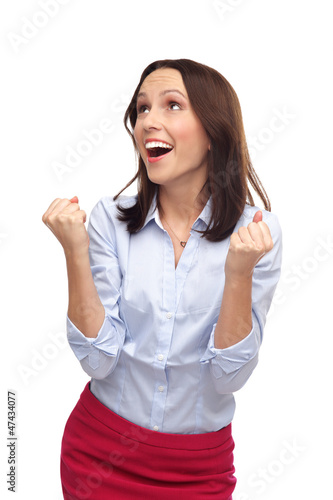 Photo: Businesswoman clenching fists Businesswoman clenching fists