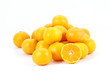Tangerines heap with one halved showing juicy centre, isolated