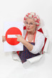 Woman with curlers and no trespassing sign
