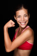 Playful Asian athlete flexing her arm