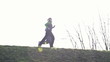 Couple jogging outdoors, slow motion