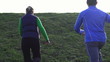 Couple running up the hill, super slow motion, shot at 240fps