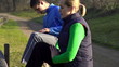 Young joggers stretching, exercising outdoors