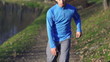 Tired man catching breath during jogging, super slow motion