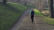 Woman jogging in park, crane shot