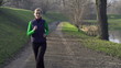 Woman jogging in park, crane shot