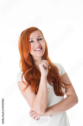 Photo: Smiling redhead gazing into the distance Smiling redhead gazing into the distance