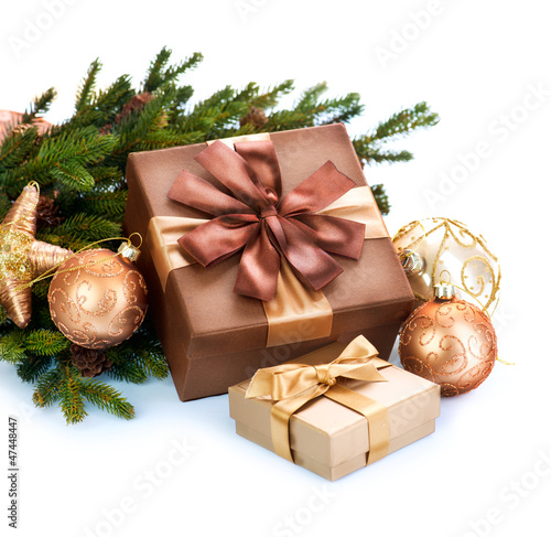 Photo: Christmas Decoration and Gift Boxes Isolated on White Background Christmas Decoration and Gift Boxes Isolated on White Background
